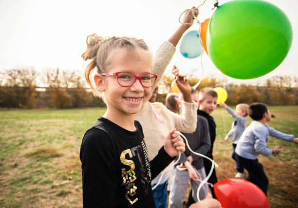 istock Playful kids have fun with balloon's 1065454136
