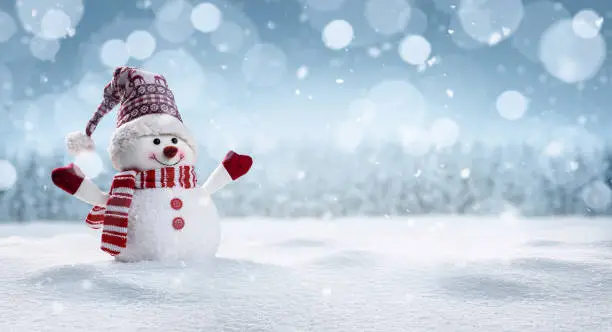 Photo of Happy snowman in winter secenery