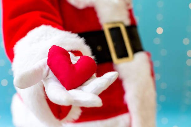 istock Santa holding a heart cushion 1065458004