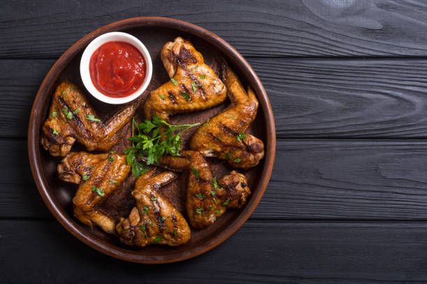 istock Grilled chicken wings with tomato sauce 1065458494
