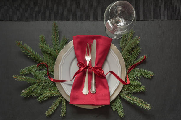 istock Christmas table setting with red decor on black. Top view. Xmas Party. 1065458784