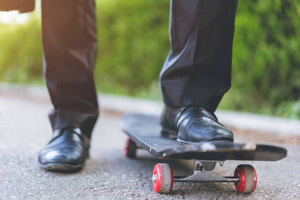 istock Businessman riding skateboard to work 1065462764