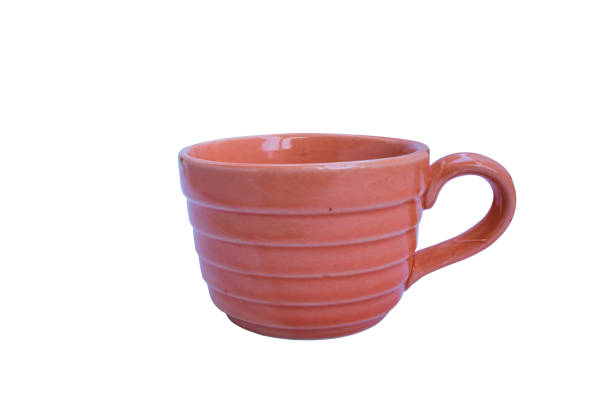 istock Orange  cup ceramic isolated on white background Clipping path white clipping path included 1065467820