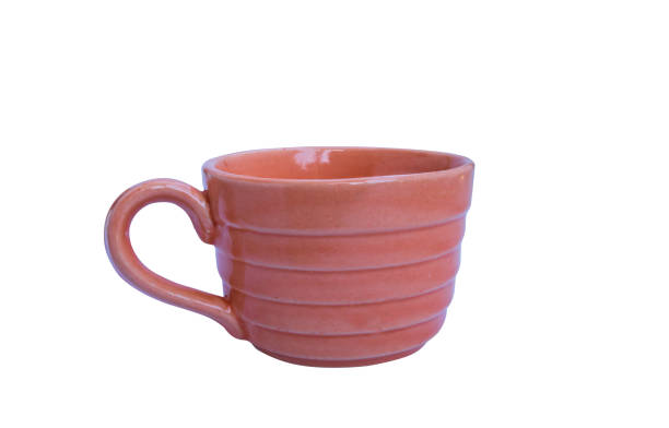 istock Orange  cup ceramic isolated on white background Clipping path white clipping path included 1065468042
