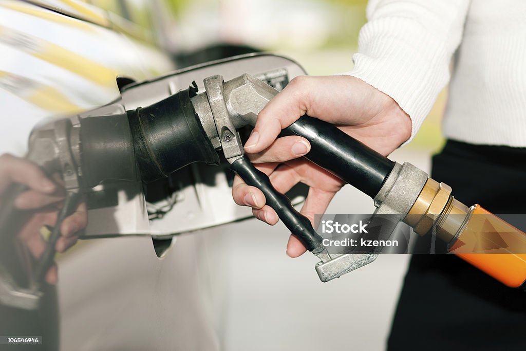 Woman refueling car with LPG gas  Liquefied Petroleum Gas Stock Photo