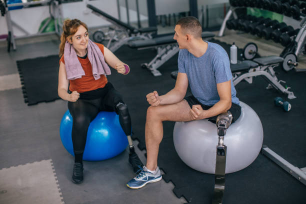 istock Disability couple sitting in gym 1065470216