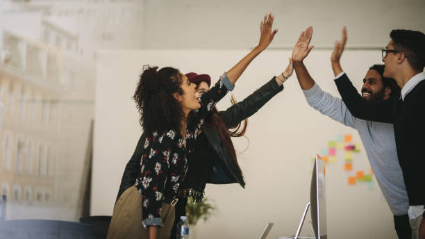 istock Happy business partners celebrating in office 1065474734