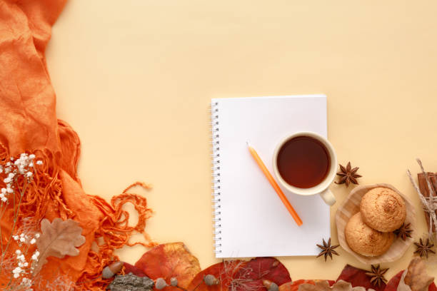 istock autumn leaves, cookies and paper notebook, flat lay 1065480080