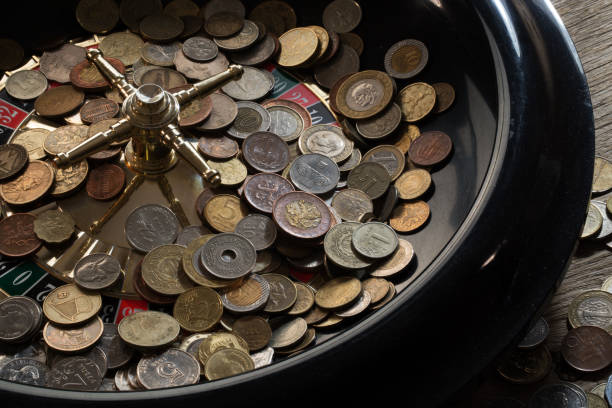 istock Roulette wheel filled with various coins 1065480506