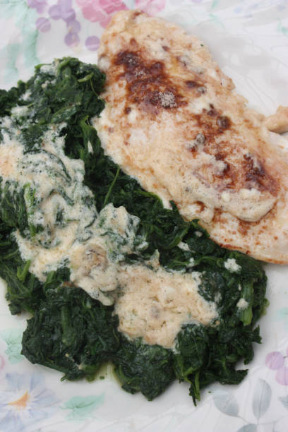 istock Turkey escalope with cream served with spinach 1065483716