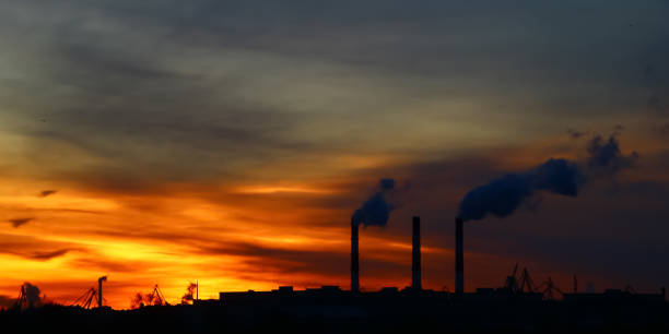 istock chimney emission on background a sunny dawn 1065492784