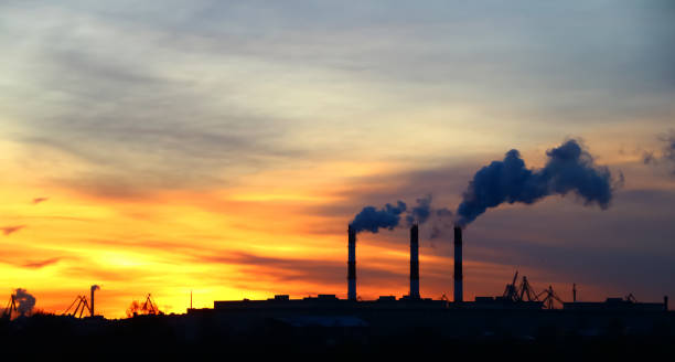 istock chimney emission on background a sunny dawn 1065492792