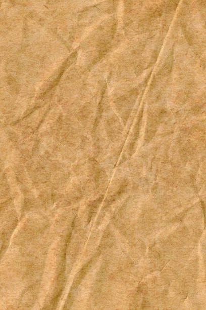 istock Old Recycle Brown Kraft Paper Rough Crushed Crumpled Grunge Texture Sample 1065495324