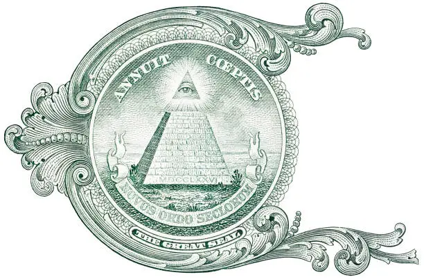 Photo of Detail from the one dollar bill, showing the pyramid with eye and the inscription Annuit Coeptis.