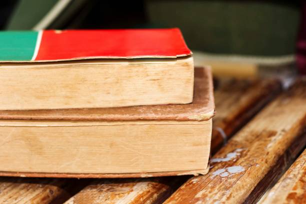 istock Pile of books on a wooden table 1065498834