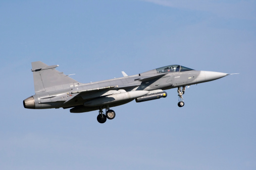 Beja, Portugal: parked General Dynamics F-16 Fighting Falcon of the Portuguese Air Force - Jaguars Squadron, with NATO logo on vertical stabilizer - equipped with external fuel tanks - Beja Airport serves both civil and military aviation.