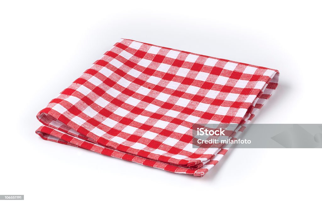 Red and white gingham tea towel on white background Red and white tea towel Tablecloth Stock Photo