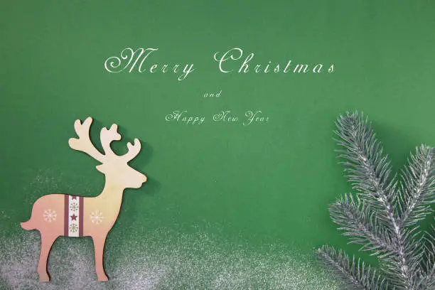 Greeting card with a Merry Christmas tree and snow, a symbol of the holiday, family togetherness. Happy New Year.