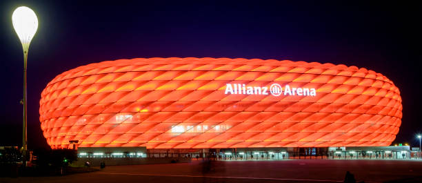 Munich, Allianz Arena football stadium Allianz Arena football stadium, where the FC Bayern Munich has played its home games since the 2005–06 season. The exterior is made of inflated ETFE plastic panels, that full change the color. It is located at the northern edge of Munich. allianz arena stock pictures, royalty-free photos & images