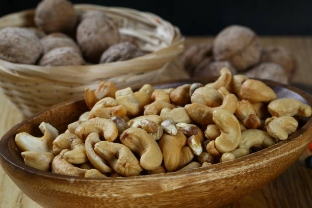 istock Cashew nuts in wooden bowl 1065521430