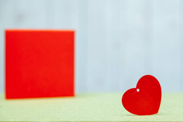 istock wooden heart and a red box gift 1065522508