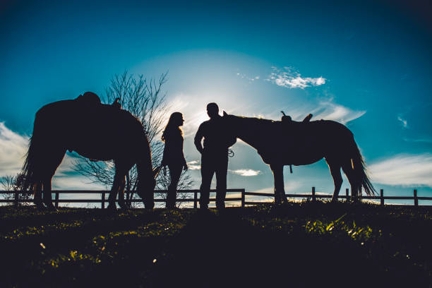 istock Couple on horse farm 1065523882
