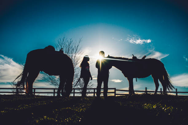 istock Couple on horse farm 1065523896