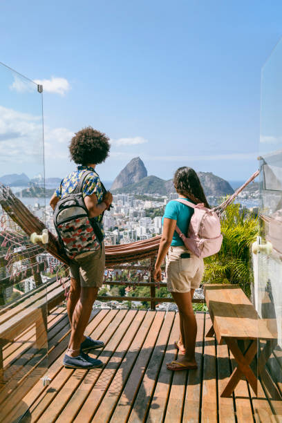 istock Young couple on decking looking at Sugar Loaf Mountain 1065524334