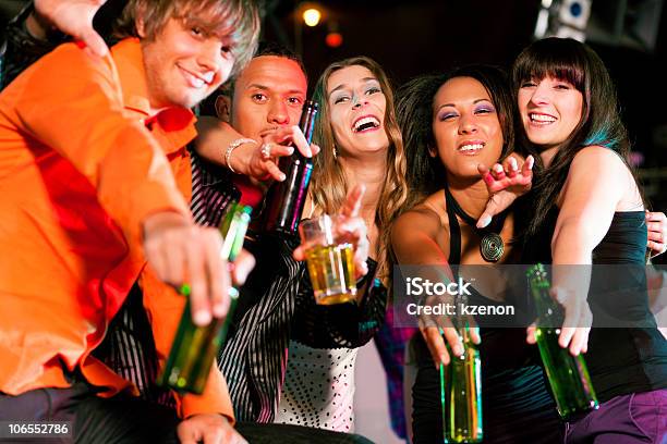 Group Of Diverse Friends Drinking Alcohol In A Nightclub Stock Photo - Download Image Now