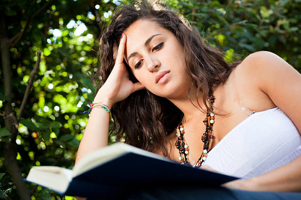 istock Girl at Park Reading a Book 106553083