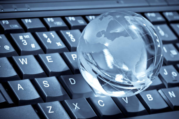 istock glass globe on a laptop keyboard 1065532888