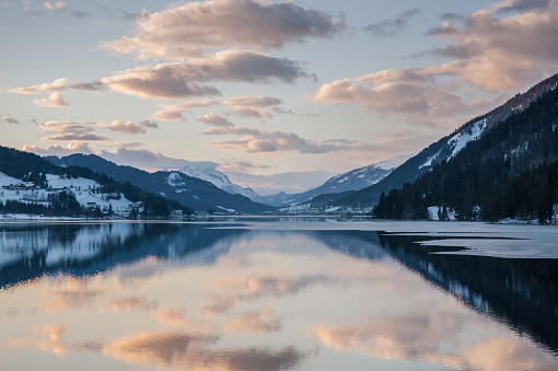 Lake Weissensee with picturesque reflection in winter, Carinthia, Alps, Austria