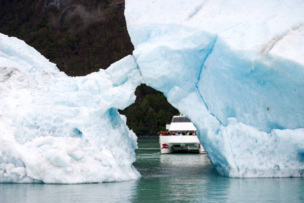 istock Sailing between icebergs floating in the water 1065535554