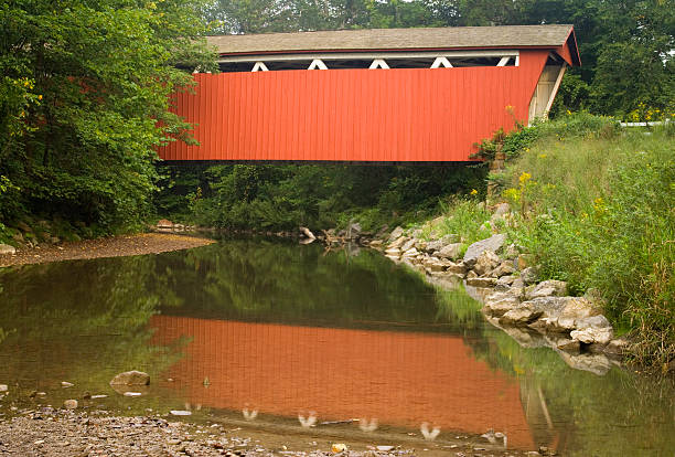 Red Covered Bridge Over a Stream  everett washington state stock pictures, royalty-free photos & images