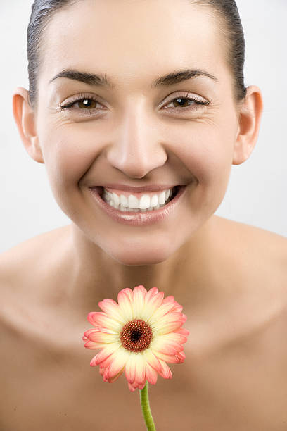 istock Close-up of beautiful face with flowers 106553687