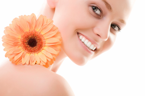 Close-up of beautiful face with flowers. On white background