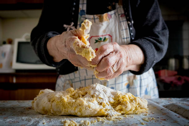 istock old italian lady's making home made italian pasta 1065543546