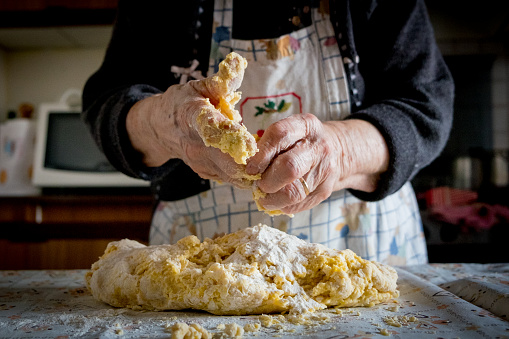 grandma making pasta the old traditional way