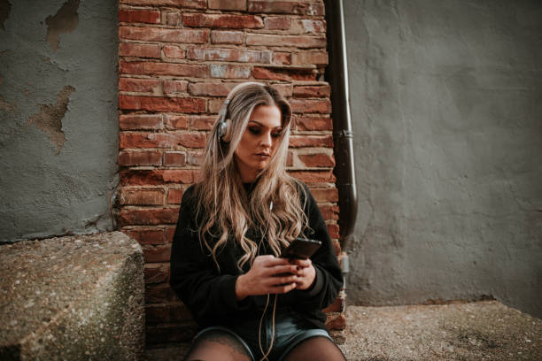 istock Young woman sitting with headphones 1065544132