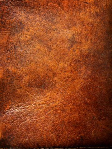 Old leather with tattered eges. Very big image. Makes a great Photoshop alpha channel/layer mask when desaturated.