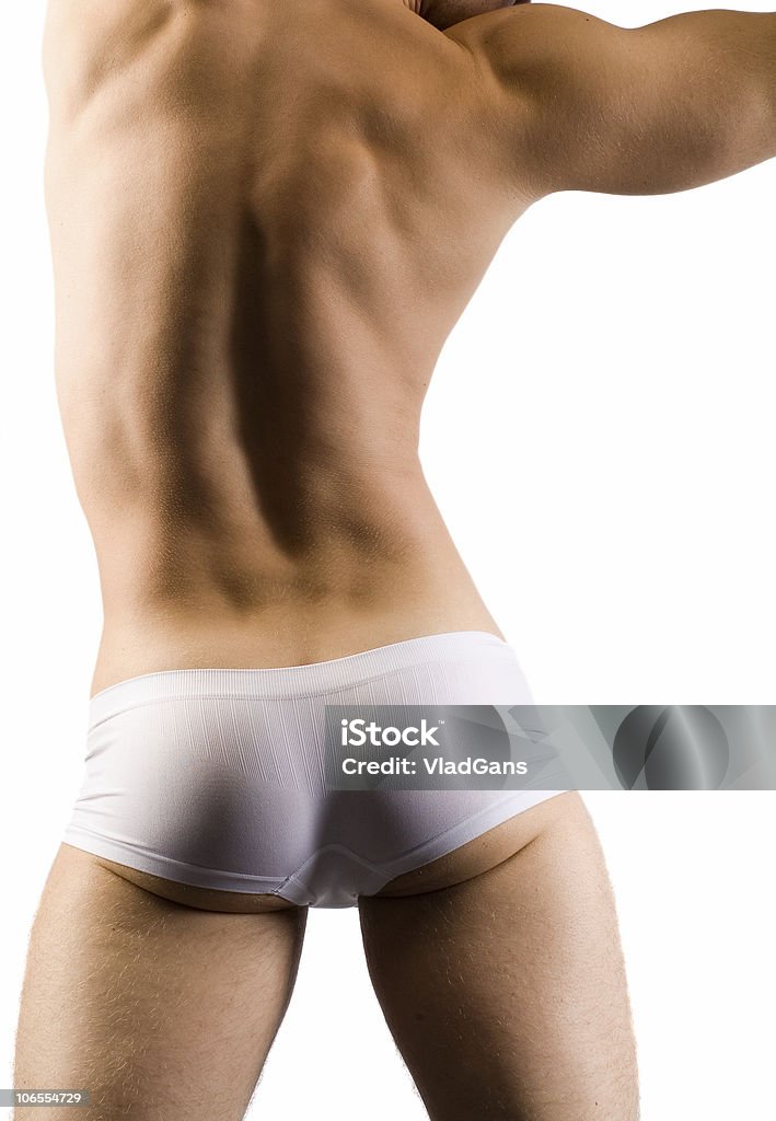 Maschio muscoloso indietro in pantaloncini bianchi - Foto stock royalty-free di Nudo