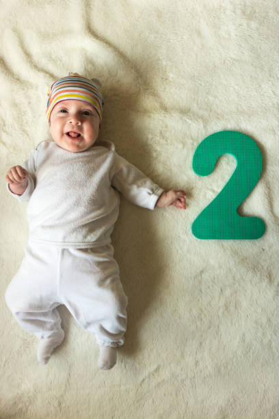 istock Little baby laying on a bed 1065548338