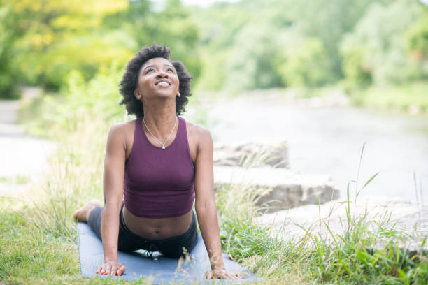 istock In the park doing yoga 1065557896