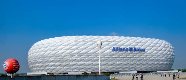 Munich, Allianz Arena football stadium Allianz Arena football stadium, where the FC Bayern Munich has played its home games since the 2005–06 season. The exterior is made of inflated ETFE plastic panels, that full change the color. It is located at the northern edge of Munich. allianz arena stock pictures, royalty-free photos & images