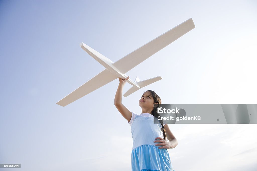 Pretty girl playing with toy glider  Model Airplane Stock Photo