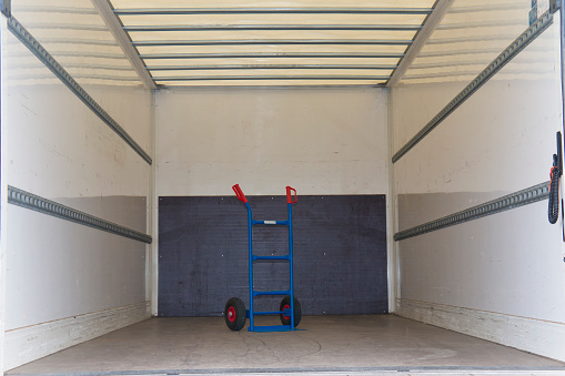 interior of a truck with a hand truck
