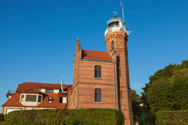 Lighthouse in Ustka against blue sky. \nUstka, Pomerania, Poland.