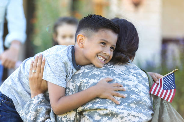 istock Happy boy embraces his military mom 1065578830