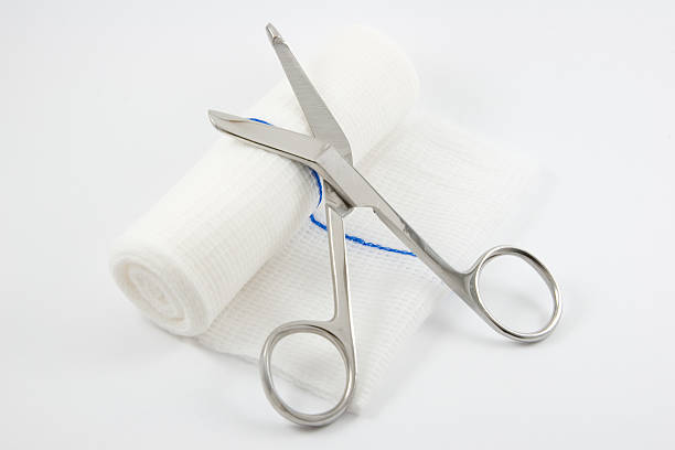 Medical Supplies, Bandage Sheers Sheers on a rolled Bandage, More in my healthcare and medical supply lightbox below. gauze stock pictures, royalty-free photos & images