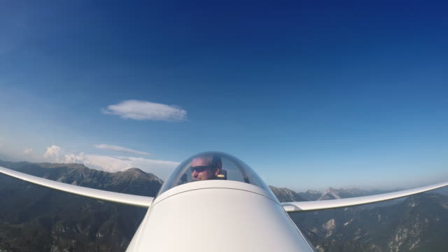 LD Pilot in the glider looking at the beautiful countryside below him
